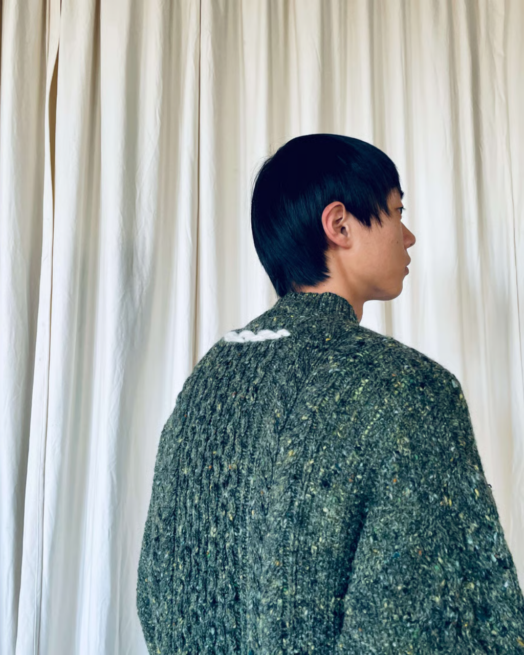 green sweater