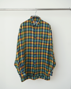 CALCÈLのKey West Shirts製、オレンジ・青・緑・黄の多色チェック柄長袖シャツ。ゆったりとしたシルエットで織り感のある生地が特徴。