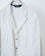 CALCÈLのPolo by Ralph Laurenオフホワイトの3つボタンシングルジャケット。斜め畝のある生地とノッチドラペルが特徴的なゆったりとしたシルエット。