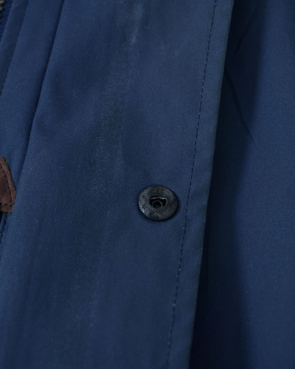 CALCÈLのPolo by Ralph Laurenユーティリティジャケット。RL POLO刻印のスナップボタンとネイビーのコットン生地のディテール。